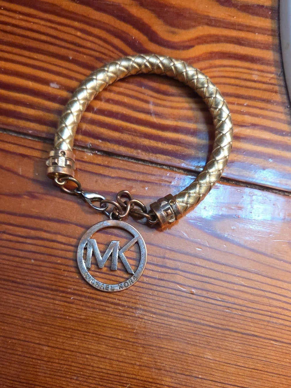 Michael Kors Gold Braided Bangle with MK Logo Charm